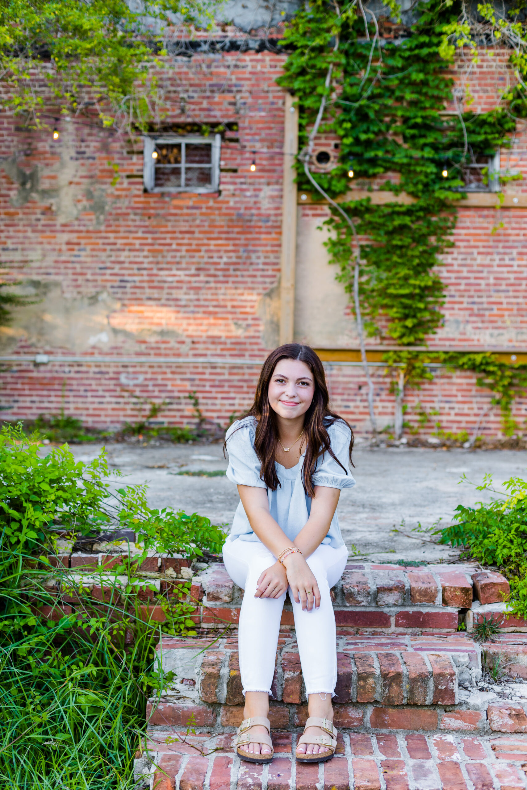 High School Senior Girl sitting on steps for senior portraits