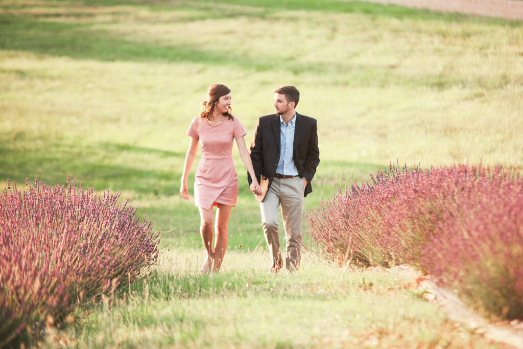 Couple walking through lavender rows